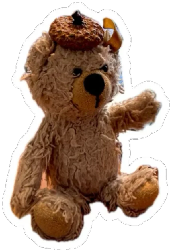 Der Honigsohn: ein zotteliger Teddy mit Strickmütze, der winkt